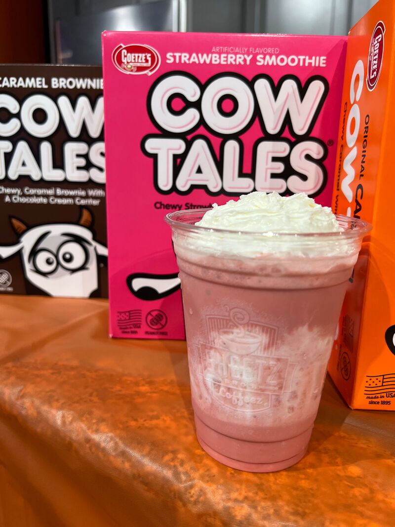 Strawberry Smoothie Cow Tales milkshake with whipped cream on top.