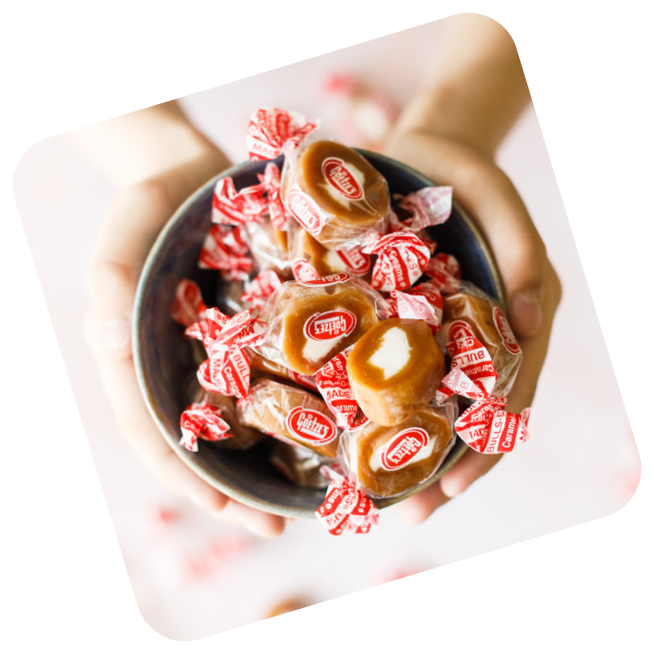 Hands holding bowl of Caramel Creams