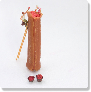 Little people climbing a caramel apple Cow Tale