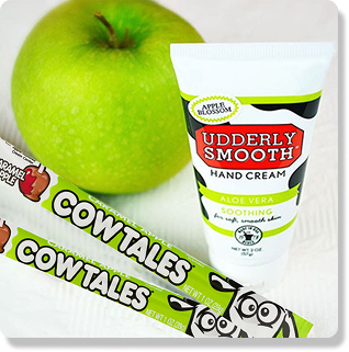 Two caramel apple cow tales, some hand cream, and an apple