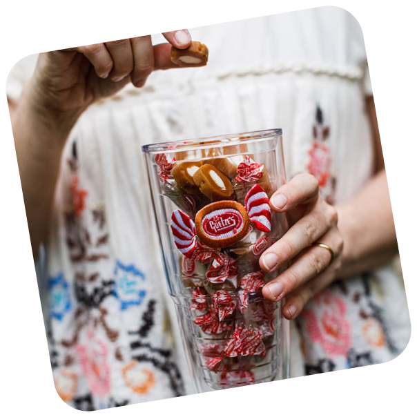 Person holding cup of Caramel Creams
