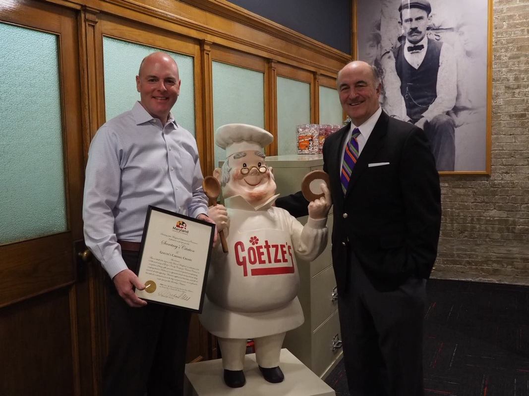 Mitchell Goetze, CEO of Goetze's Candy Company (left) with Secretary Mike Gill from the Maryland Department of Commerce (right).