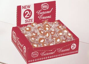Vintage display packaging for Caramel Creams candies, labeled 2 cents each.