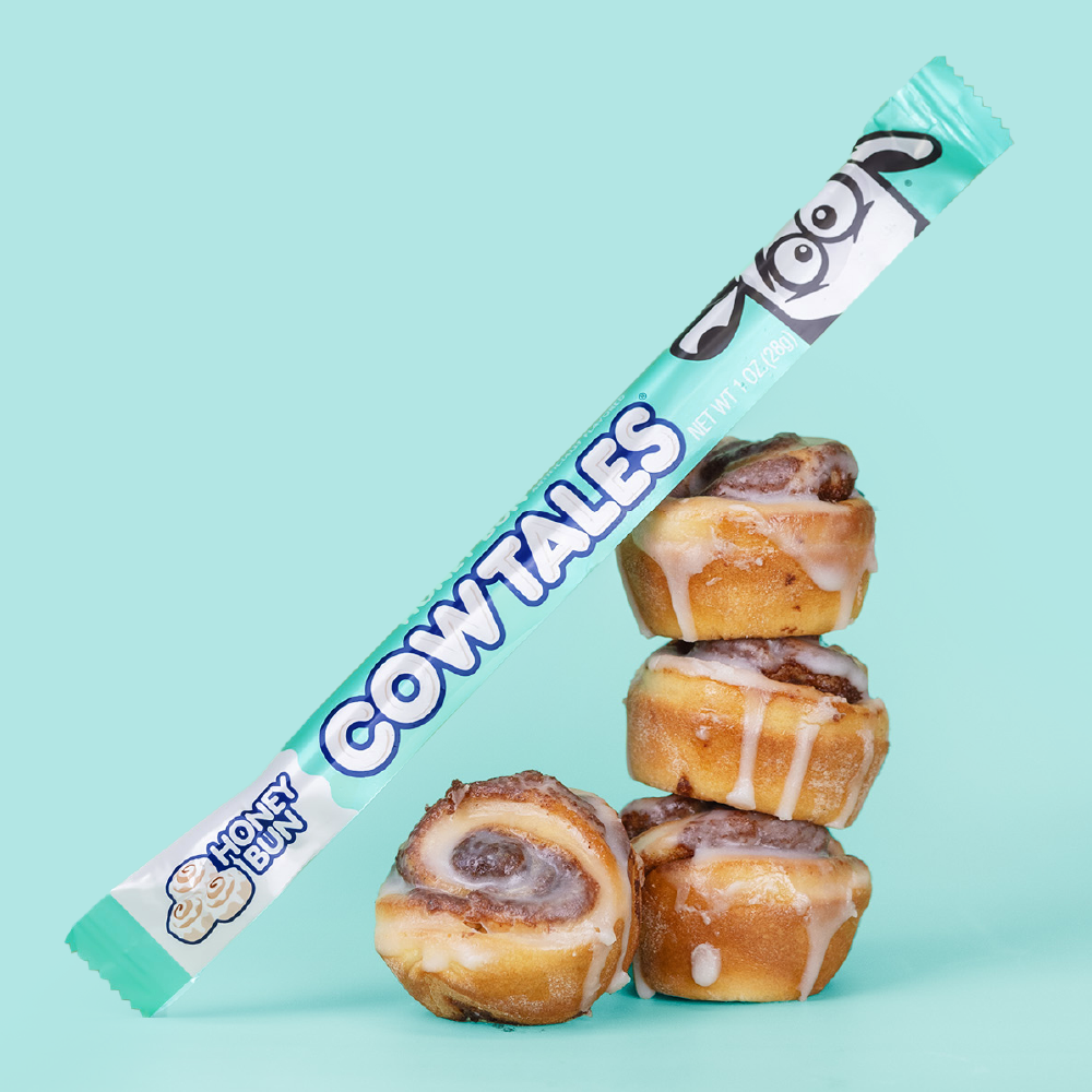 Honey Bun Cow Tale® sitting on a stack of honey buns