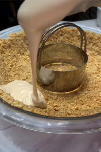 Adding the caramel pudding around the outside of the crust