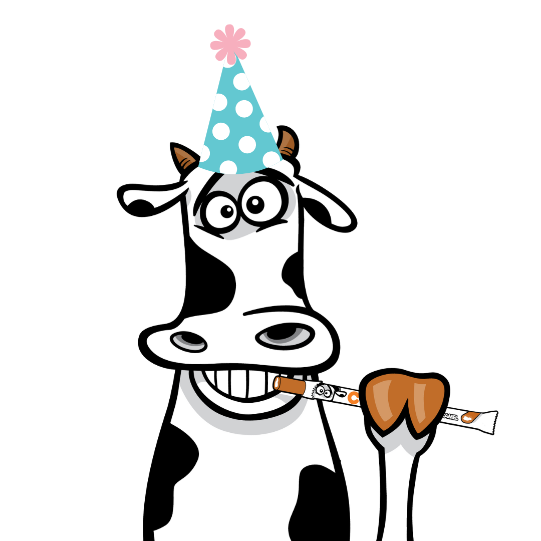 Duke the cow in a birthday hat holding a Cow Tale®