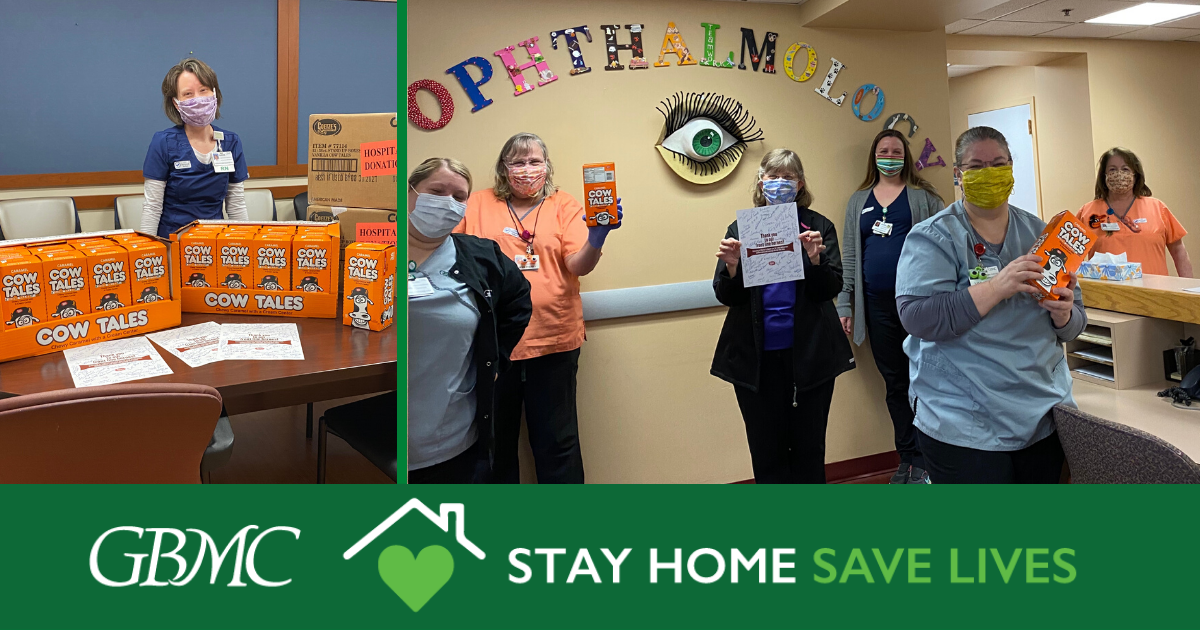 Healthcare workers at GBMC pose with boxes of Cow Tales candy during a donation, with a banner reading “Stay Home Save Lives” along the bottom.