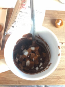 Mug with Duncan Hines cake mix and diced Goetze Caramel Creams