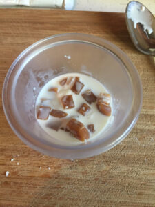 Glass bowl with 2 diced caramel creams and half & half