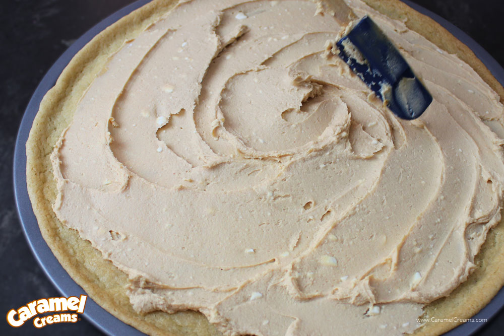 peanut butter and cream cheese spread on dessert pizza crust