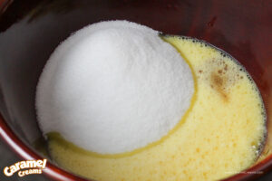 Eggs and sugar in a mixing bowl