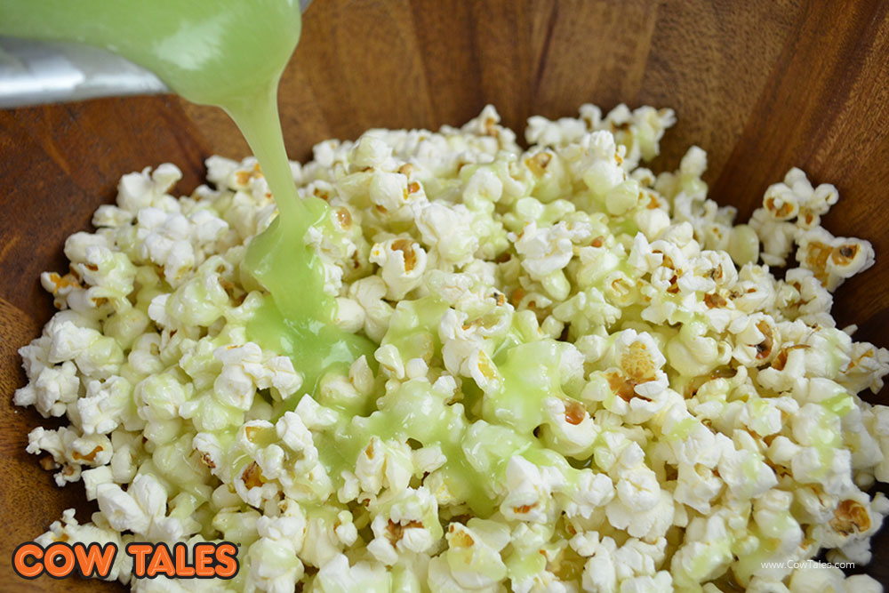Apple gelatin poured on popcorn