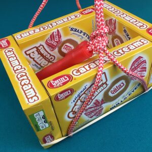 Five Caramel Creams boxes tied together with a jump rope and rubber bands