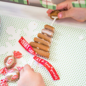 Topping off the cow tale tree with a caramel cream