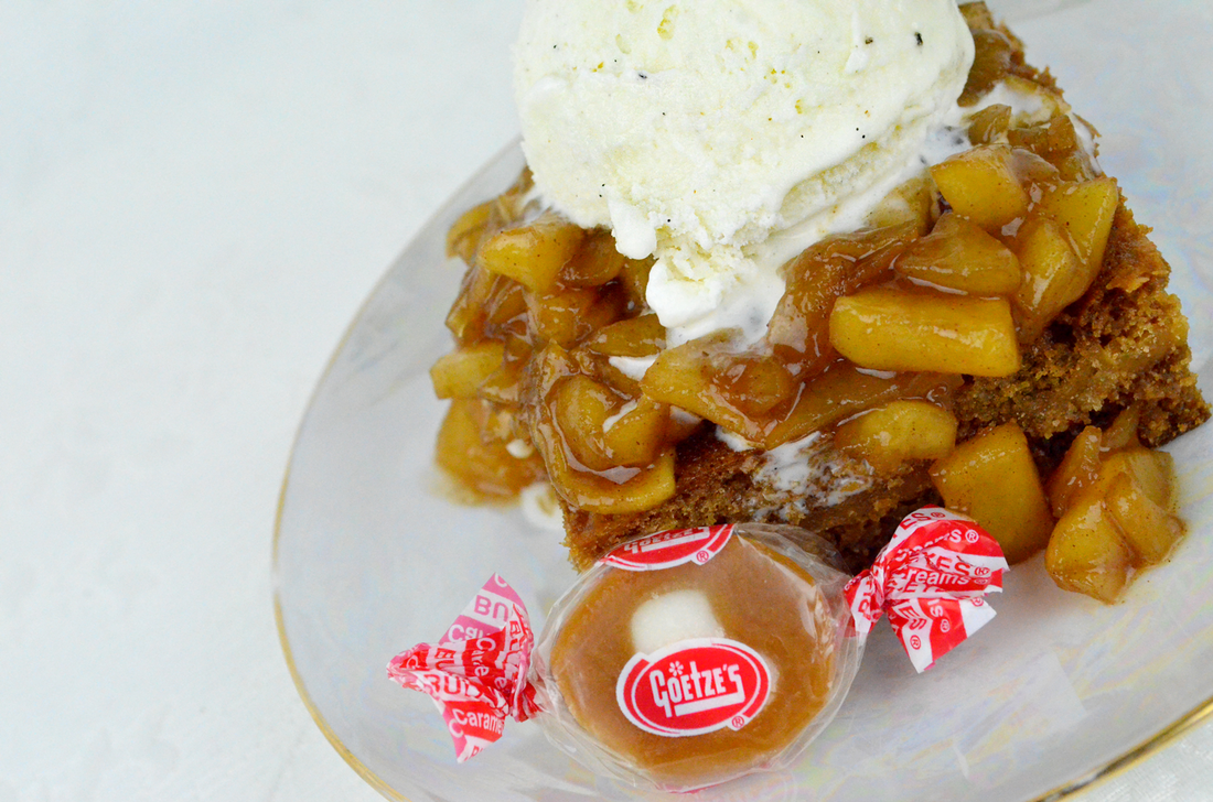 a portion of Caramel Apple Cookie Bars on a plate with a caramel cream and a dab of ice cream on top.