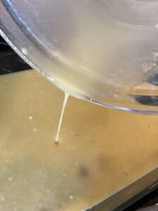 Pouring mixture into baking dish