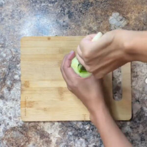 Carving out the green apple
