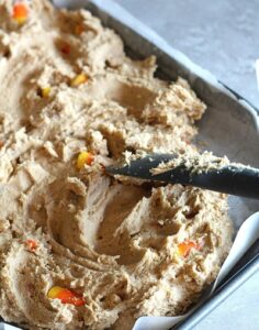 peanut butter caramel blondies mixture in a pan